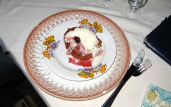 Donut filled with jam and cream in Romania