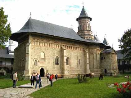 The 16th century painted church at Moldovita Monastery with frescoes covering the outer walls.